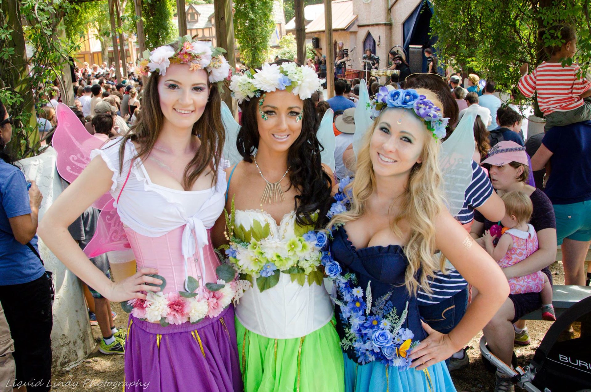 Renaissance faire attendees in creative fantasy costumes